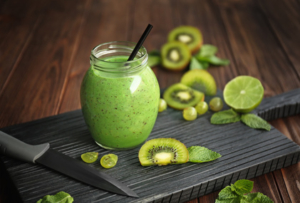 Refreshing fruit smoothie on table